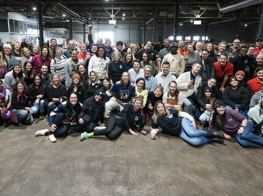 Group of Ékip Jeunesse volunteers in the warehouse, community involvement